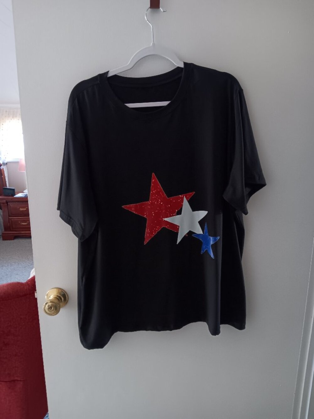 Woman's black top with red, white and blue stars 4X new